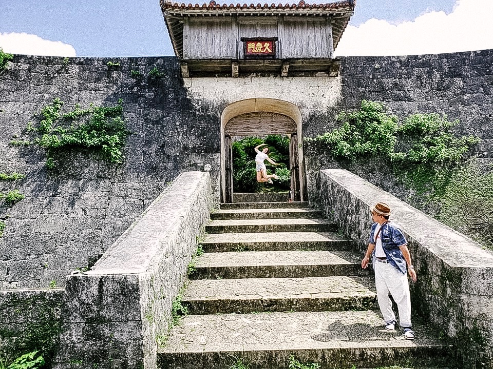 Jen Lyman jumping on the steps of a Japanese Palace