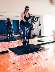 Alex Harris, certified trainer and registered dietitian at New Leaf Nutrition, teaches a spin class